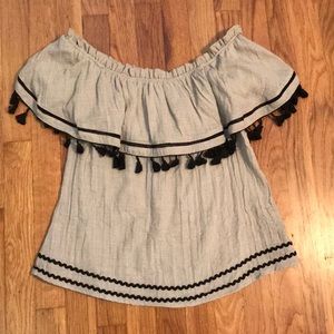 An off the shoulder brown and black shirt